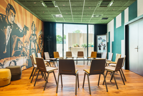 Chair circle in a seminar room at Hotel Schani UNO City